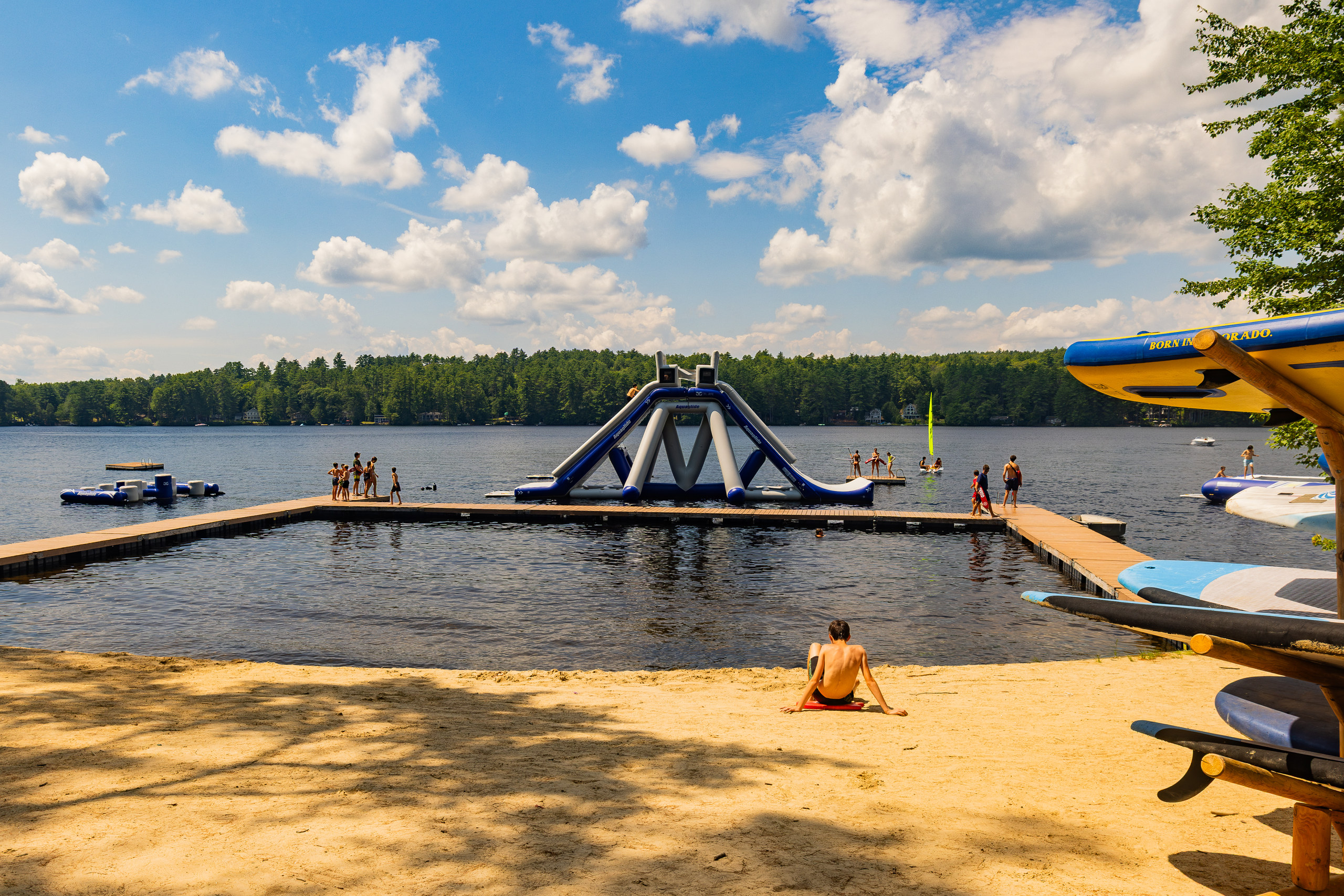 The waterfront at Camp Kingswood, Maine: the dock and the slide in afternoon light