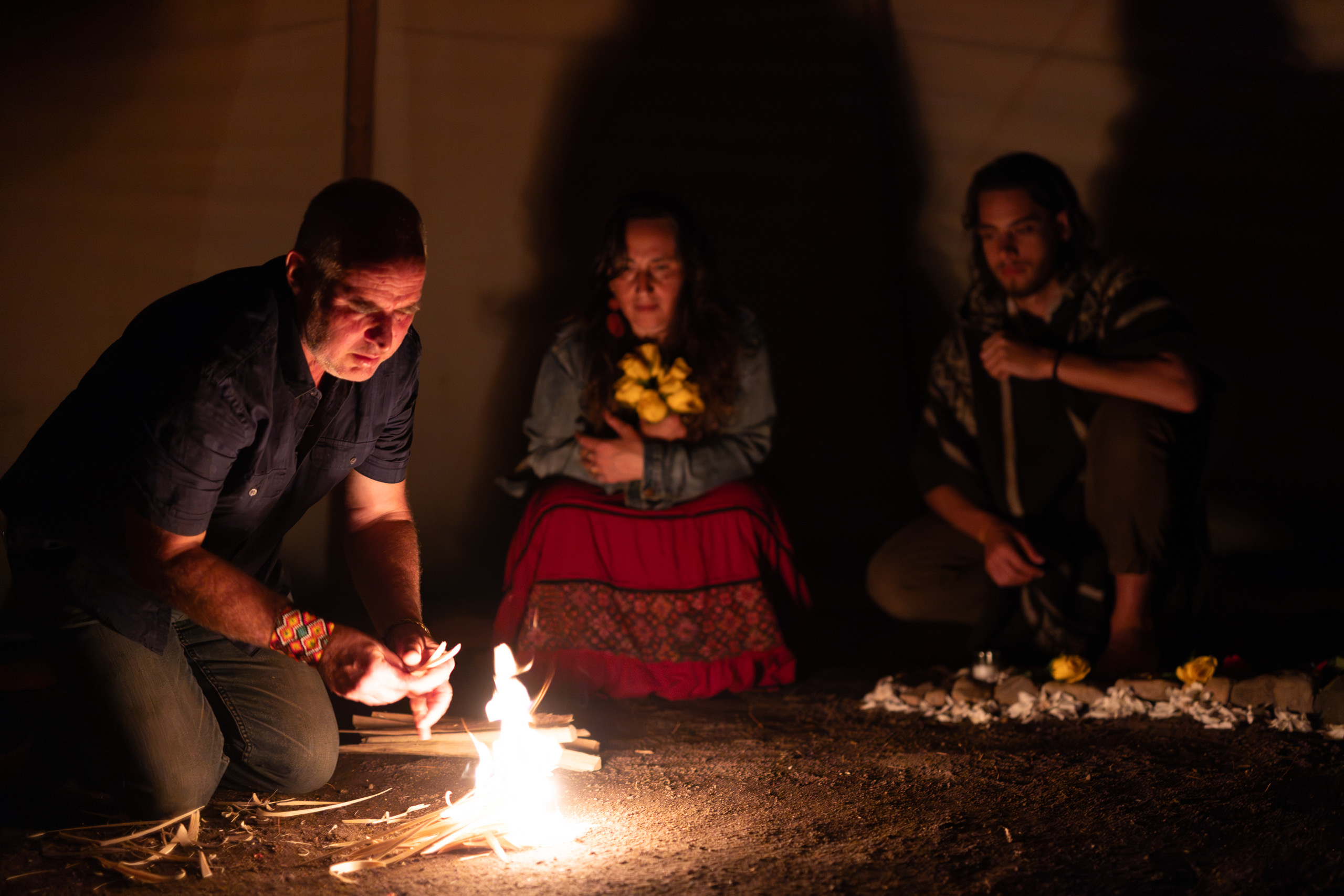 The fire being lit inside the circle at night