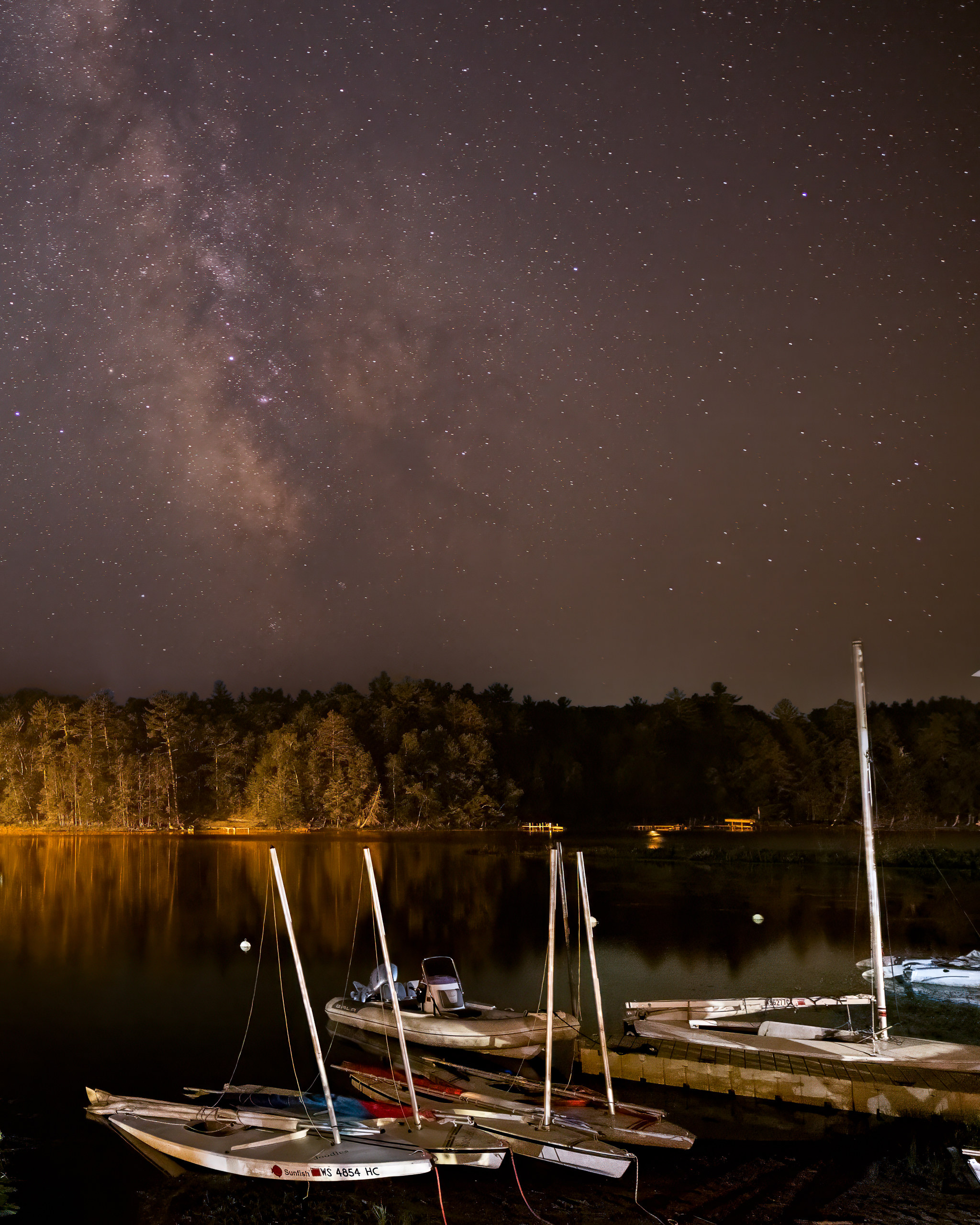 The Milky Way over a camp waterfront