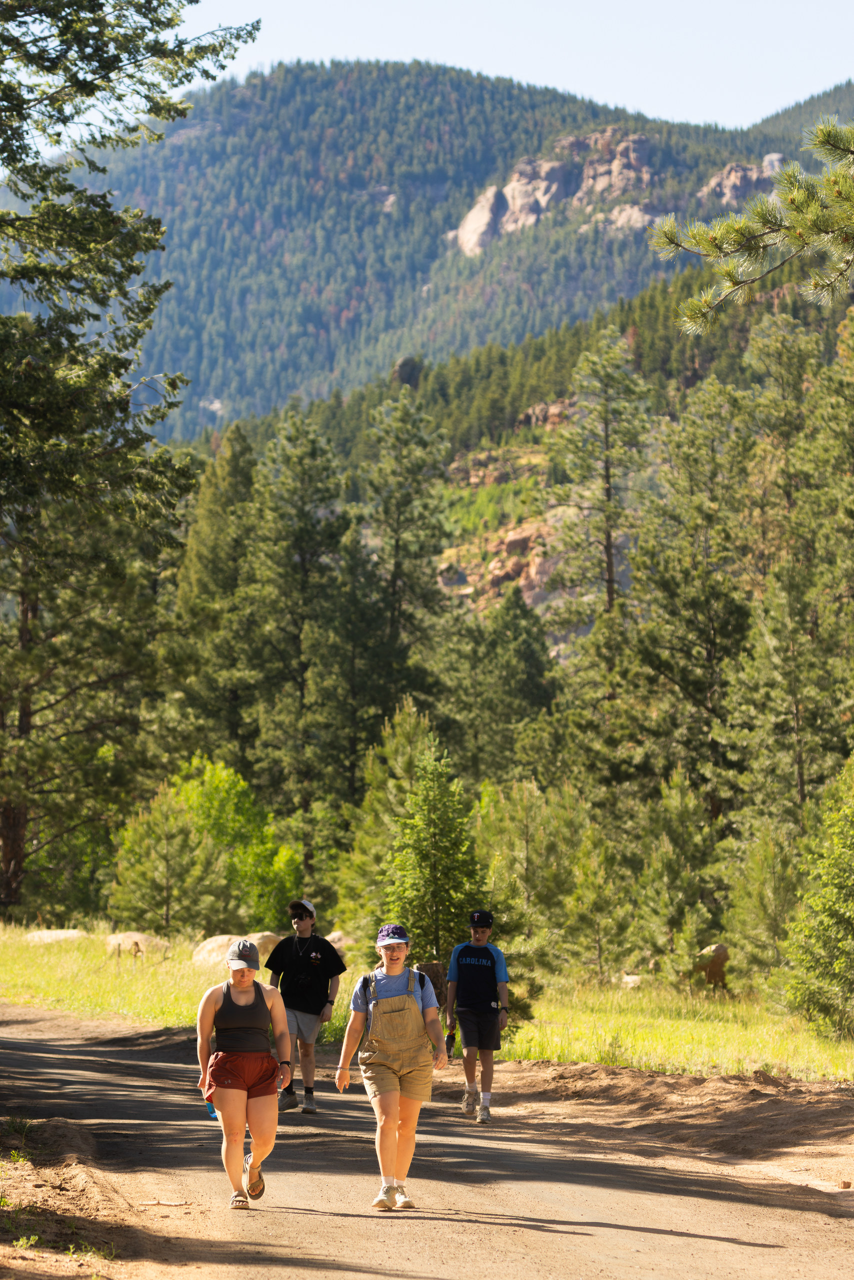 Campers walking the trail into camp